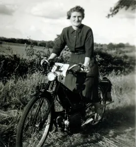 Learner: Lady learner on a 1930s/40s Velocette motorcycle