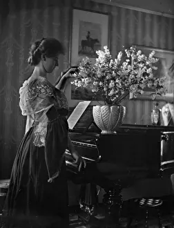 Gracious: Lady with piano in interior