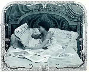 Pillows: Lady reading the newspaper in bed
