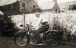 Michael Cole: Lady sitting on 1918 Triumph motorcycle
