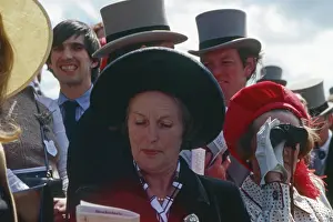 Punters: Lady studying the form on Derby Day