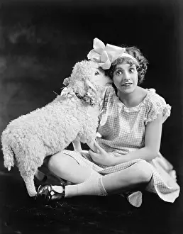Naive: Lamb whispering into a teenager's ear