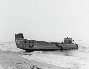 Pony: A landing craft beaches to unload troops during