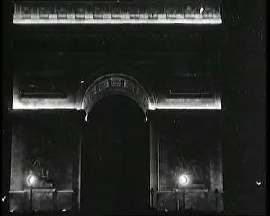 Larc: L'arc de Triomphe in Paris At Night Lit Up By Lights