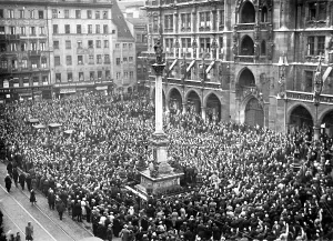 Symbolized: Large crowd awaits hoisting of swastika, Munich