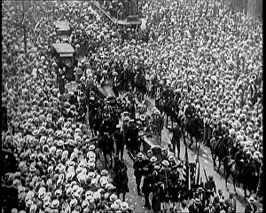 Ticker: A Large Crowd Watching a Ticker Tape Parade