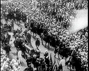 Ticker: A Large Crowd Watching a Ticker Tape Parade