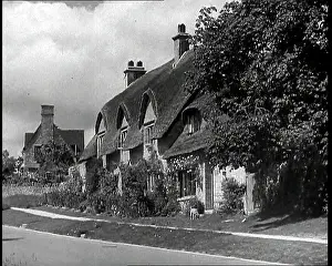 Paved: A Large Detached Thatched Cottage Next to a