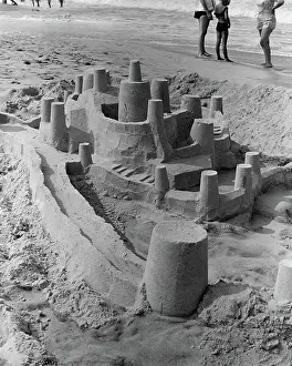 Ephemeral: Large detailed sand castle with moat and several