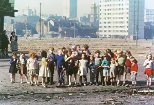 Wasteland: Large group of children on waste ground