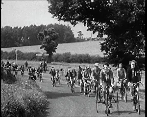 Lanes: Large Group of Civilians Riding Bicycles Through