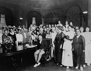 Voting: A large group, mostly women, standing around a