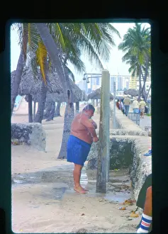 Showering: Large man taking a shower, Florida, USA