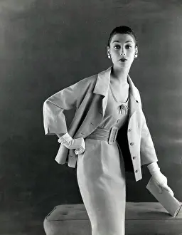 Confident: Late 1950s model in sharp cut pale dress and jacket