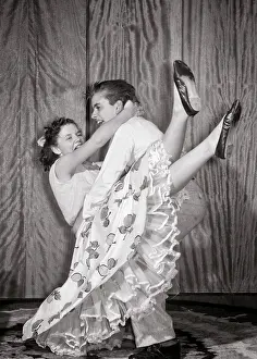 Teenaged: Laughing Active Teen Couple Doing Jitterbug Dance