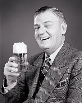 Oldsters: Laughing Older Man in Suit and Tie Looking at