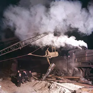 Lifts: Laying railway tracks at night