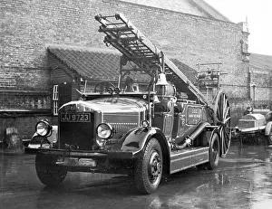 Repainted: LCC-LFB Dennis open pump escape at a fire station