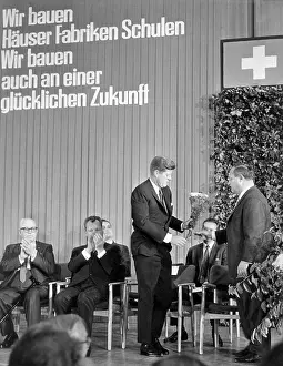 Applaud: Leber presents a carnations bunch to Kennedy