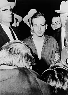 Bruises: Lee Harvey Oswald escorted by officers at ?