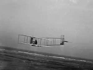 Strut: Left rear view of glider at a low altitude, showing the fixe