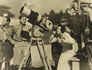 Right Wing: Leni Riefenstahl looking through a large camera