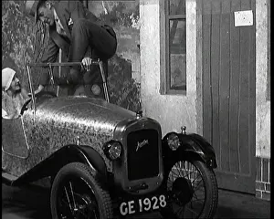 Henson: Leslie Henson Climbing Into a Car And Getting