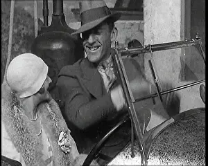 Henson: Leslie Henson Climbing Into a Car And Getting
