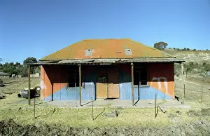 Veld: Lesotho, , 2004: A brightly coloures tin house. housing