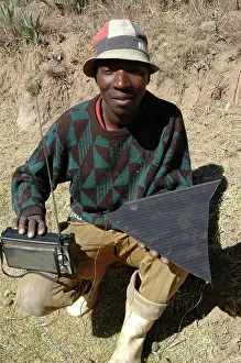 Lesotho: Lesotho, 2004, A man with his radio powered by a broken