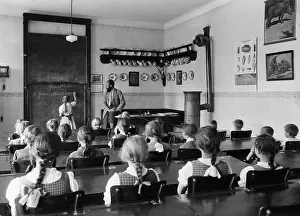 Writes: Lesson in a village school, 1935