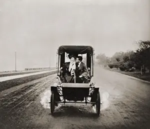 Usz62: HE LETS HER STEER WHILE HE GETS HER EAR. ?