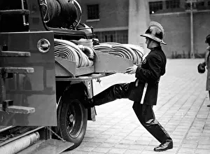 Leverage: LFB firefighter at back of enclosed pump vehicle