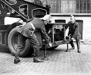 Adjust: LFB firefighters adjusting back of vehicle