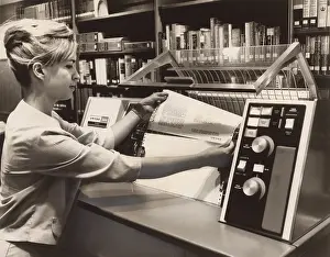 Computation: Librarian taking a printout from a UNIVAC ?