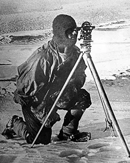 Lieut: Lieut. Evans with his theodolite, South Pole expedition