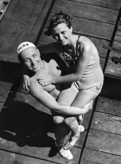 Sandals: A lifeguard posing with a female swimmer, 1939