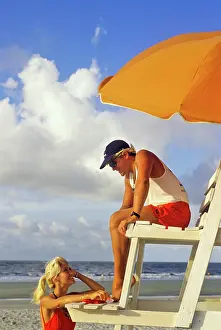 Laf002: Lifeguard Talking to Woman on Beach
