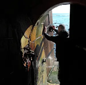 Gironde: Lighthouse keeper opening the entrance door at