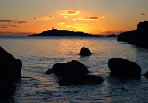 Galloway: The lighthouse on Little Ross Island flashes at sunset