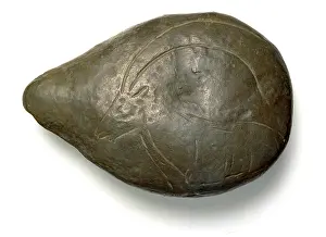 Artefact: Limestone lamp with ibex carved on back