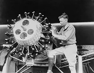 Firsts: Lindbergh examining the cylinders of the Spirit