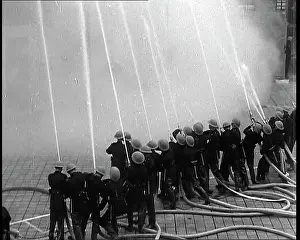 Upwards: A Line of ARP Wardens Spraying Hoses Upwards