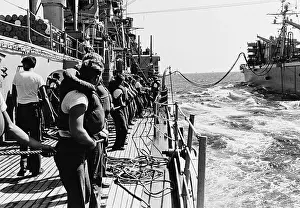 Seaman: Line handlers aboard USS Boston bring across