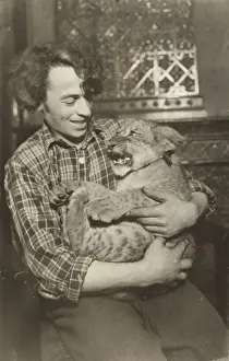 Circuses: Lion trainer with lion baby