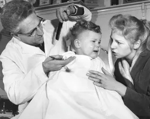 Consoling: Little boy at the barber's, London