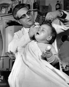 Barbers: Little boy at the barber's, London