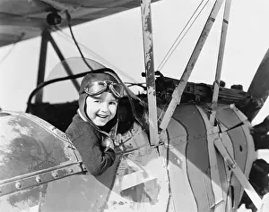 Cockpits: Little boy in cockpit of plane