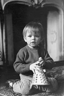 Cherubic: Little boy with a Dalek toy