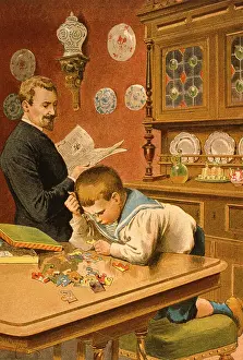 Dresser: Little boy doing a jigsaw puzzle